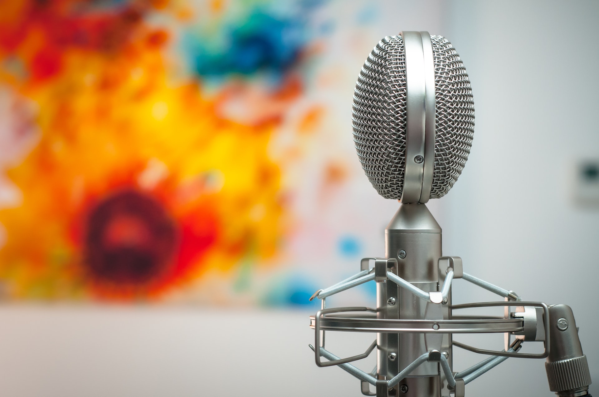 Microphone against a tie-die-colored background