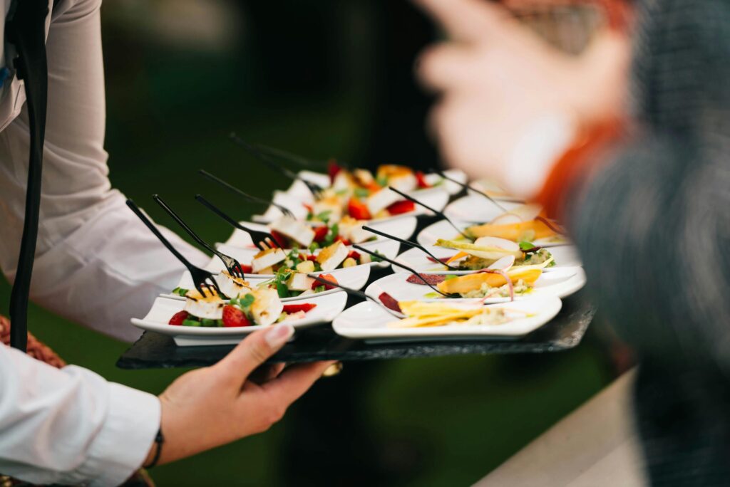 Image of waiter holding tray of hors d'oeuvres
